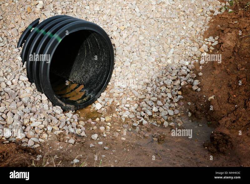 drainage-pipe-new-culvert-under-small-country-side-gravel-road-MHHK3C.jpg