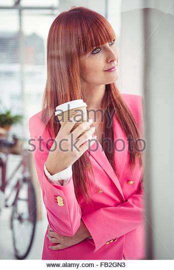 portrait-of-a-hipster-businesswoman-drinking-a-coffee-cup-fb2gn3.jpg