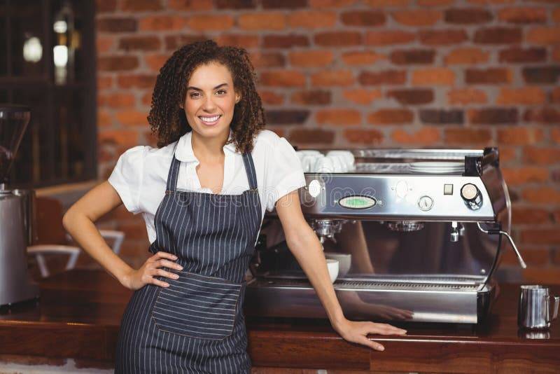 pretty-barista-smiling-front-coffee-machine-portrait-shop-56786413.jpg