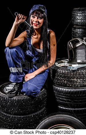 sexy-young-woman-sitting-on-a-tires-stock-photos_csp40128237.jpg