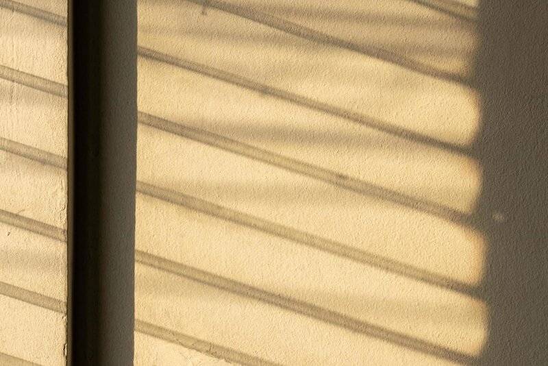 sunlight-shadow-on-the-wall-from-the-louver-window-free-photo.jpg