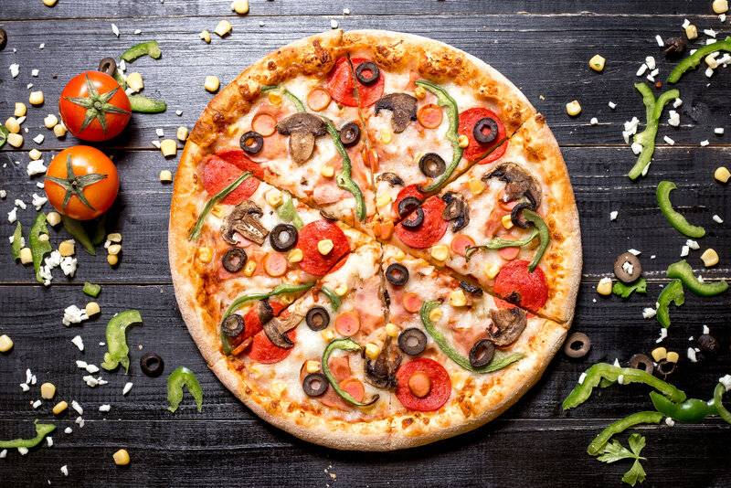 top-view-pepperoni-pizza-with-mushroom-sausages-bell-pepper-olive-corn-black-wooden.jpg