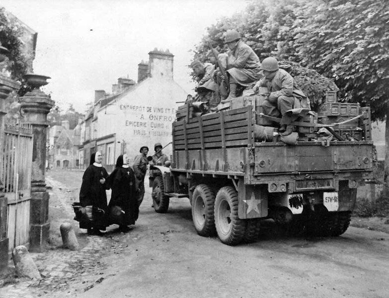 US_Infantry_in_truck_liberated_Bricquebec_Normandy_1944.jpg