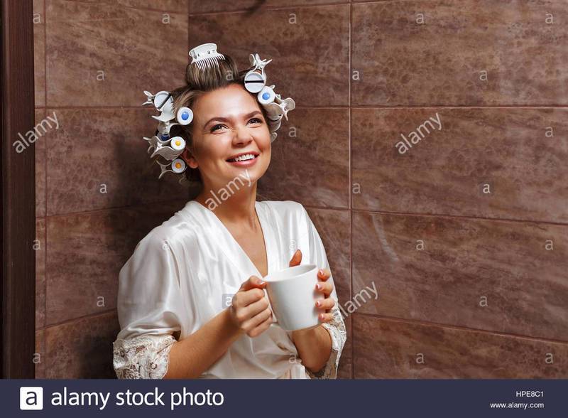 young-attractive-housewife-in-the-bathroom-girl-in-a-bathrobe-and-HPE8C1.jpg